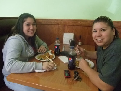 Image: Happy Customers — Blanca Figueroa and her daughter, Monseratt are enjoying their lunch. “The food is very good,” said Blanca in between bites!