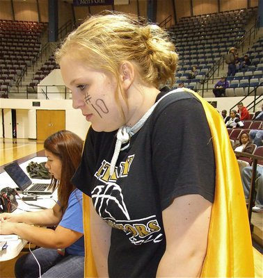 Image: Super Julia — Lady Gladiator softball player Julia McDaniel is caped up and ready to cheer for the boys in Abilene.