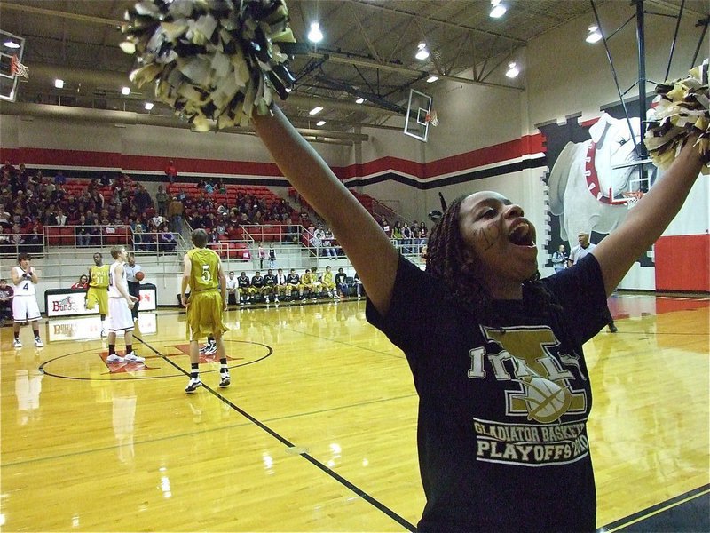 Image: Pump up the crowd — Italy High School cheerleader Jaleecia Fleming pumps up the crowd to start the area championship game between Italy and DeLeon.
