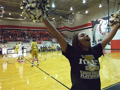Image: Pump up the crowd — Italy High School cheerleader Jaleecia Fleming pumps up the crowd to start the area championship game between Italy and DeLeon.