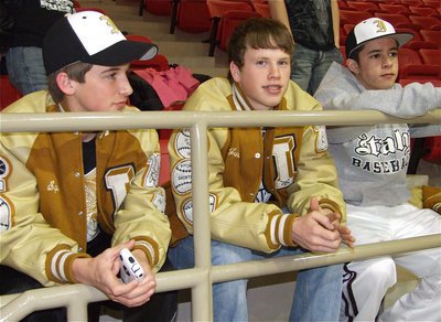 Image: Pitching in — A long way from home, members of the Italy High School baseball team, Ross Stiles, Justin Buchanan and Caden Jacinto, arrive in Hamilton to cheer on the basketball team.