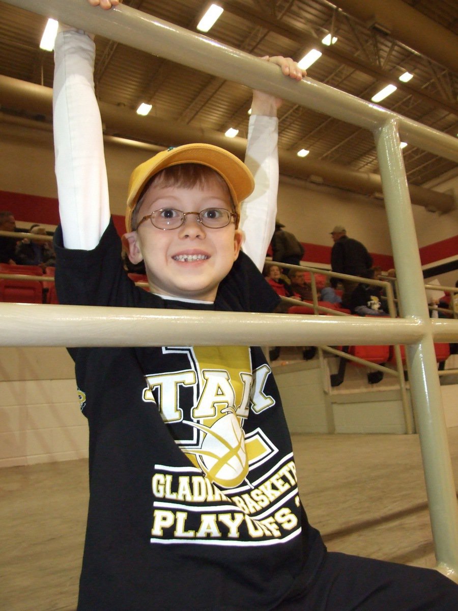 Image: Kort near the court — Kort Holley, the son of Italy’s head coach Kyle Holley, is never too far from Dad’s side.