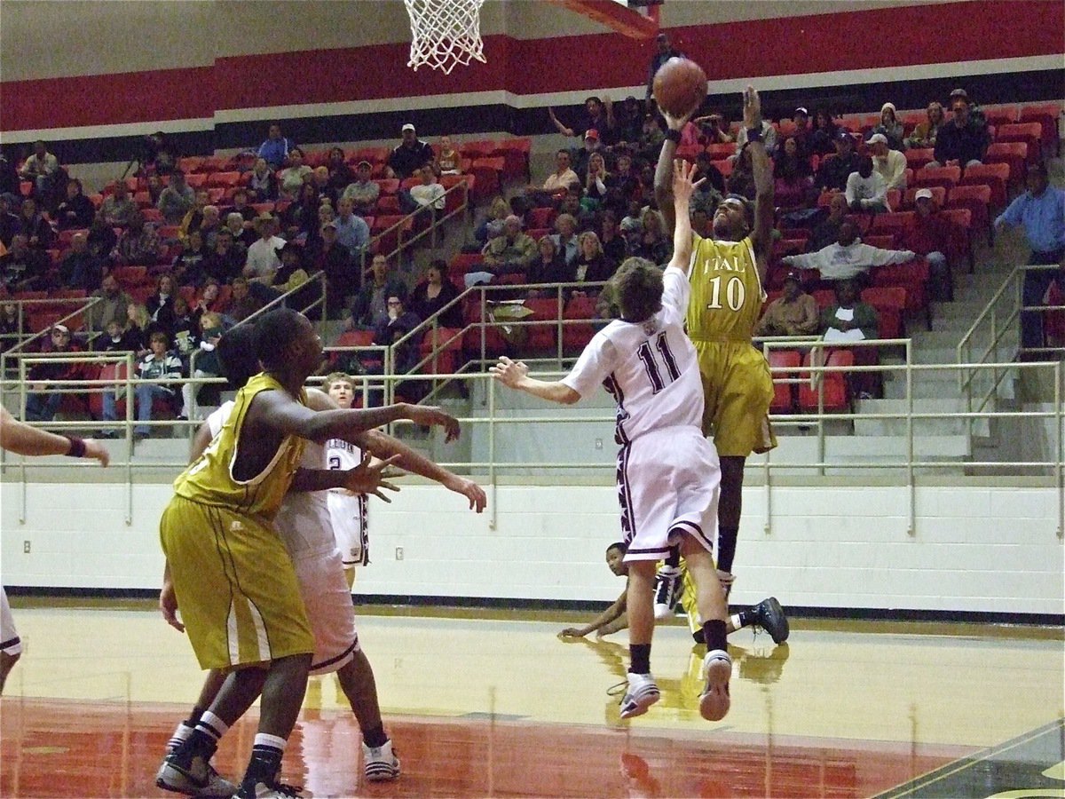 Image: No match for John — DeLeon did not have an answer for this. John Isaac(10) seemingly jumped out of the Hamilton gym Friday night on his way to scoring 23-points. I guess the dome in Italy offers John a little more head room.