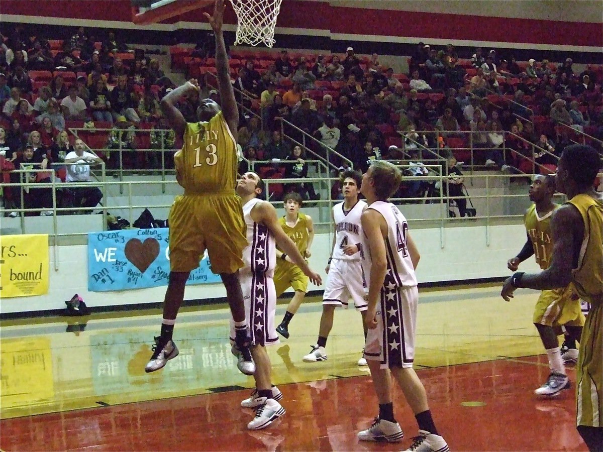 Image: Larry Mayberry  — Italy center Larry Mayberry(13) puts up a shot over DeLeon. Mayberry finished with 5-points in the area championship game.