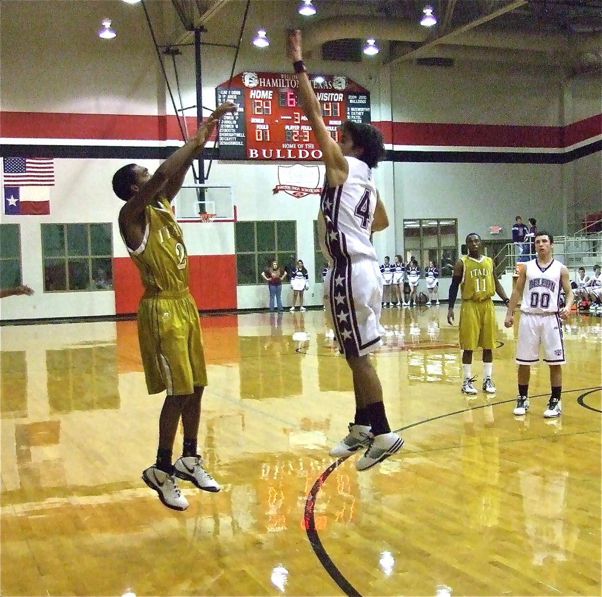 Image: Heath elevates — Heath Clemons elevates just enough to swish one of his two 3-pointers over the outstretched paw of a DeLeon Bearcat.