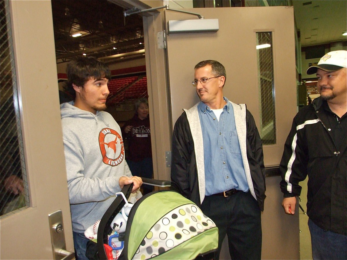 Image: Exit playoffs to the right — Italy head coach Kyle Holley and athletic director Craig Bales show DeLeon’s fans the door as they help them exit the playoffs.