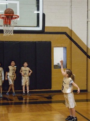 Image: It’s a spinner — Jacee “Without the Y” Coffman spins in a pre-game layup worth 1-point.