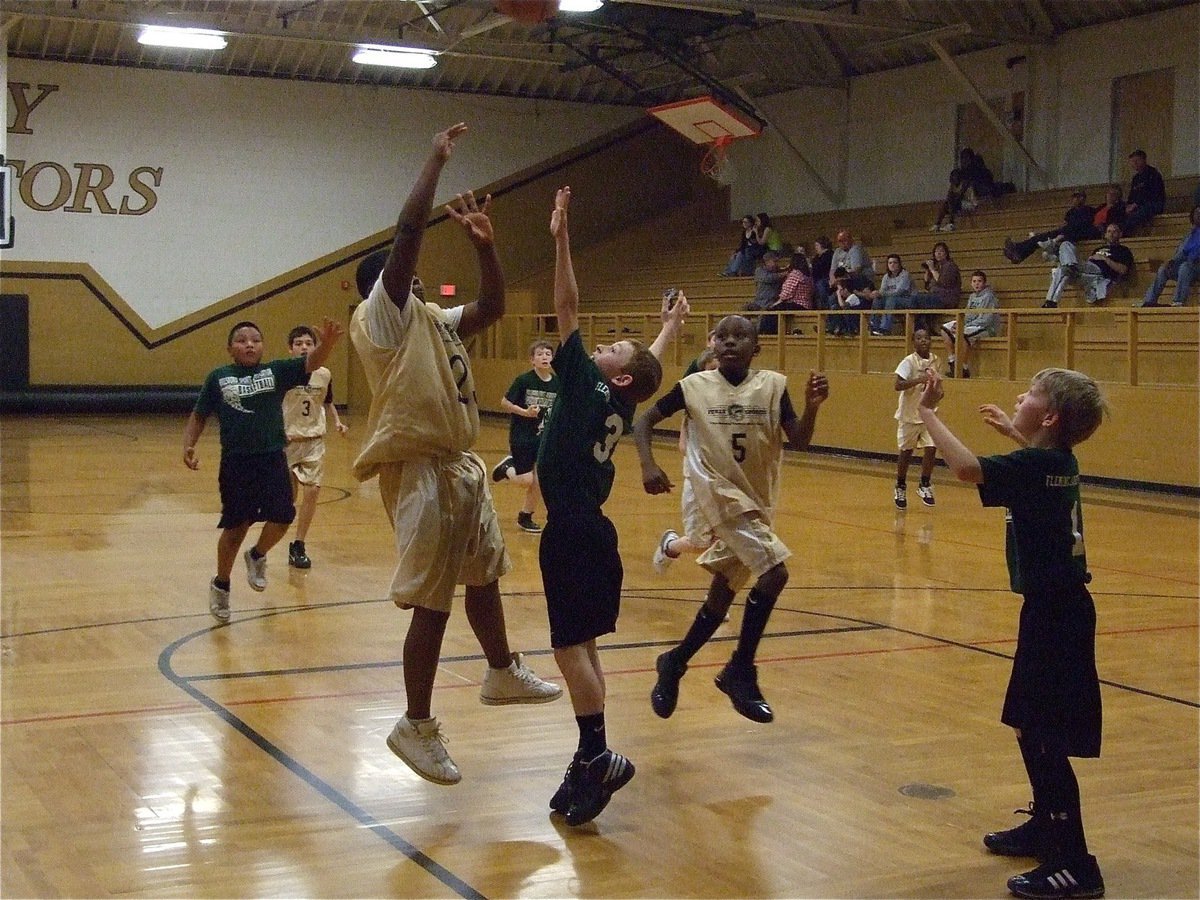 Image: Italy attacks — Kenneth Norwood(23) puts up a shot against Hillsboro as Kevin Johnson(5) flies in for the rebound.