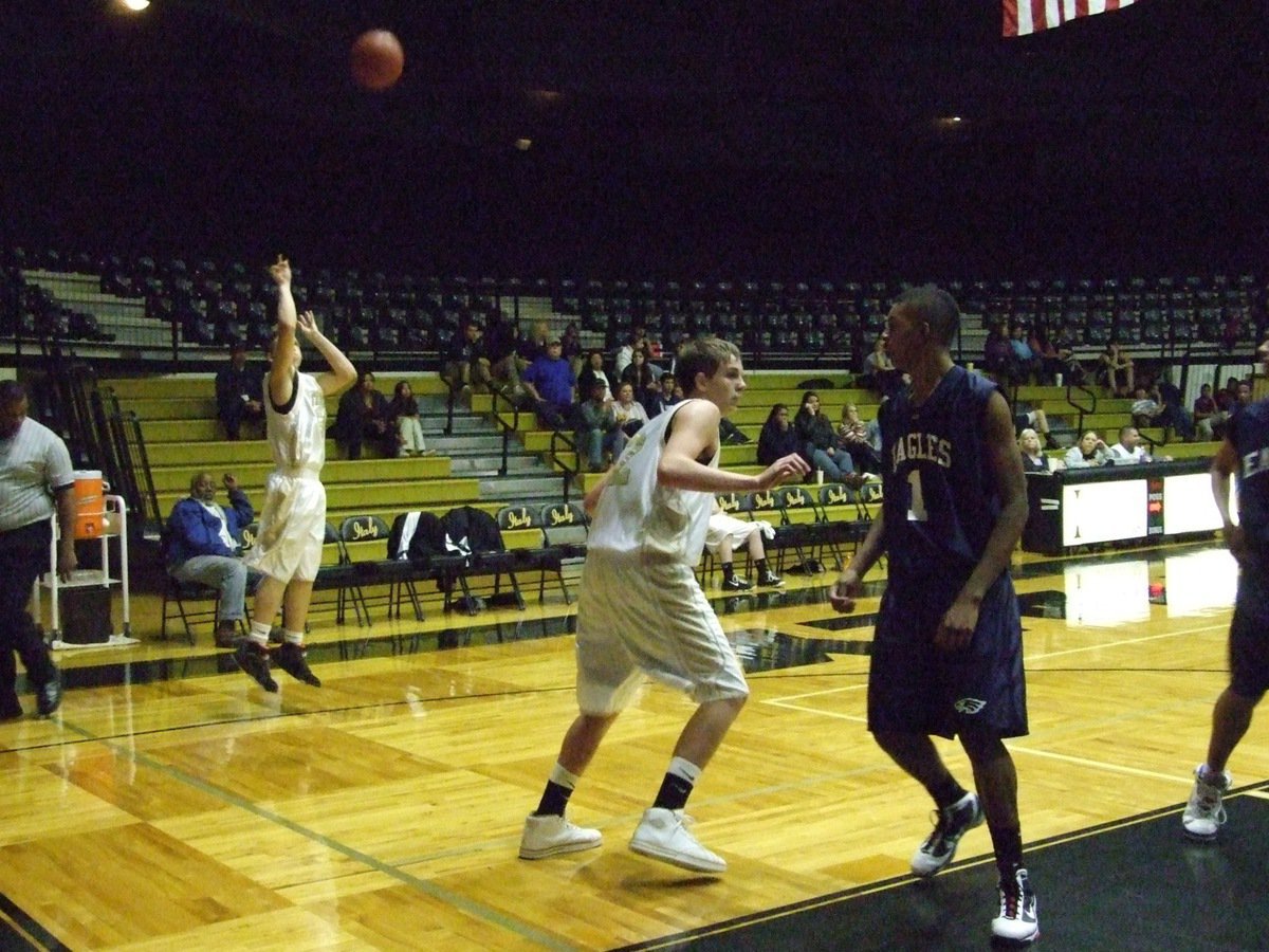 Image: Kyle from the corner — Kyle Jackson(50) shoots a 3-pointer from the corner.