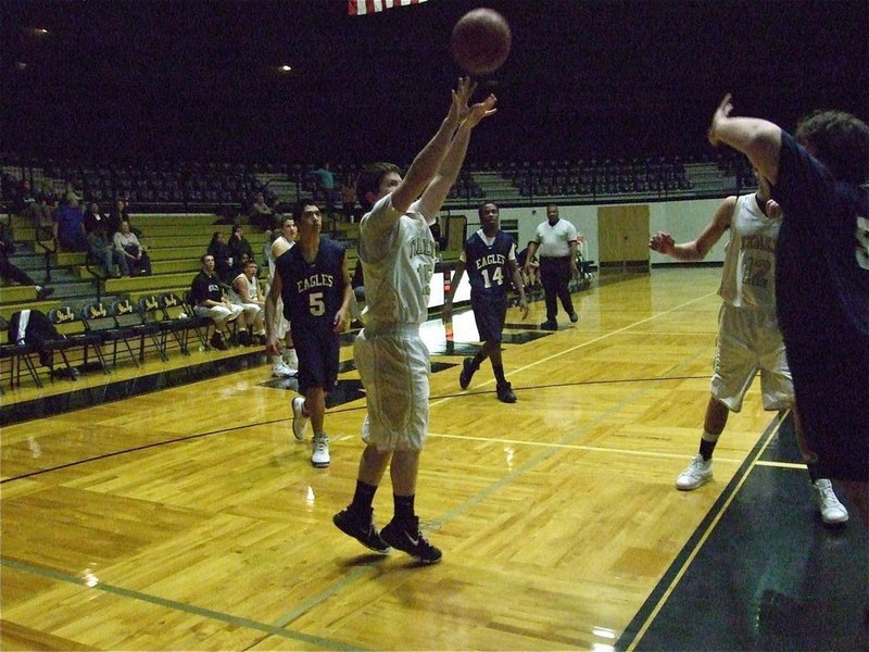 Image: Jake-n-make — Jake Escamilla(15) turns and shoots without hesitation.