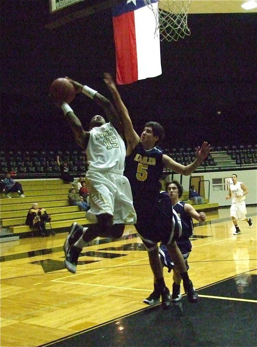 Image: Desmond’s athletic — Desmond Anderson(15) protects the ball on his way up to the rim.