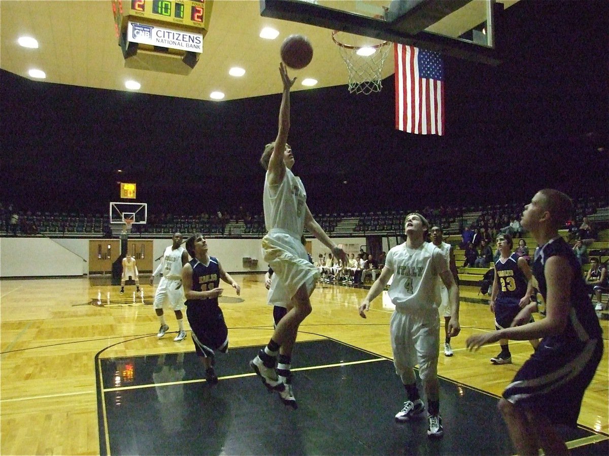 Image: Right place, right time — Colton Campbell(5) picks up a loose ball for an easy layup.