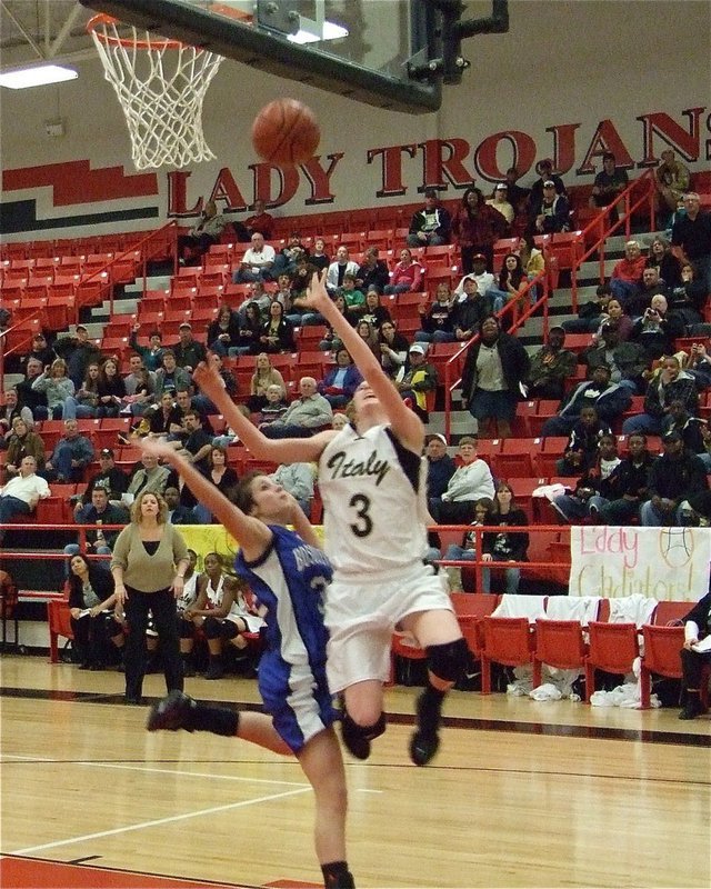 Image: 3-point play — Kaitlyn Rossa gets fouled as she scores the layup and then puts in the and-1 for a 3-point play during the bi-district game against Bosqueville.