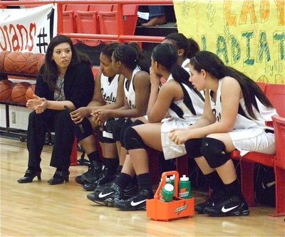 Image: Coach encourages — Coach Tina Richards keeps her Lady Gladiators relaxed on the bench.