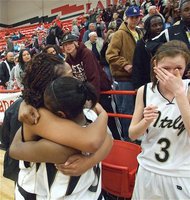 Image: What a feeling — Senior forward Jaleecia Fleming hugs freshman point guard Jameka Copeland while sophomore Kaitlyn Rossa tries to dry her tears after the Lady Gladiators won the 1A bi-district championship.