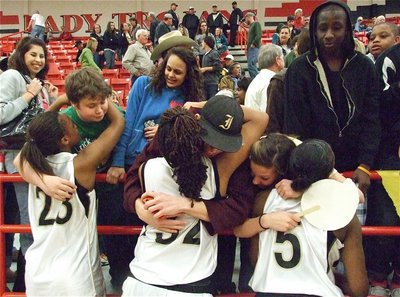 Image: Hugs all round — The Lady Gladiators receive well deserved hugs and praises after their win over Bosqueville.