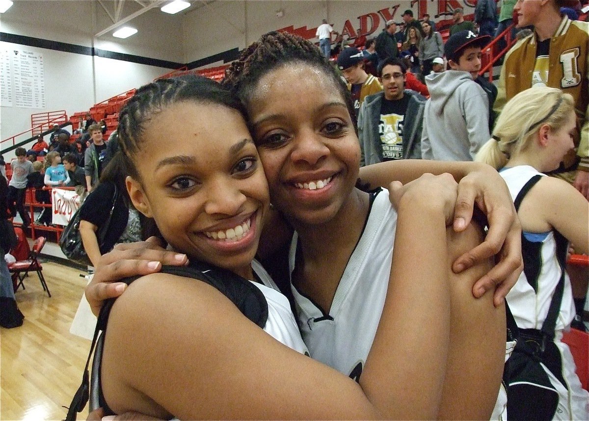 Image: Embracing the moment — Lady Gladiators Kyonne Birdsong and Jaleecia Fleming embrace after their team’s incredible performance to claim the bi-district championship.