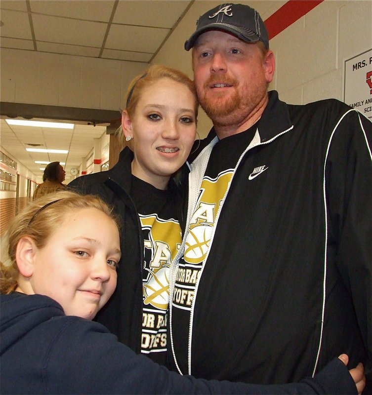 Image: Proud Dad — Allen Richards has alot to be proud of. His daughters Megan (above) and Alyssa are both players on the Lady Gladiators Basketball team. His wife, Tina Richards, helps coach the team. His daughter, Brycelen Richards (above), helped with the water. And his Mother-in-law, Rita Garza, kept the score book for Italy.