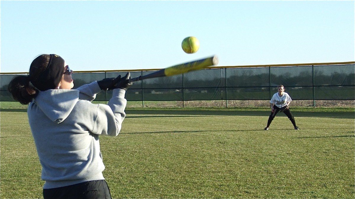 Image: The swing of things — Coach Andrea Windham hits grounders to the players before the Rice game.