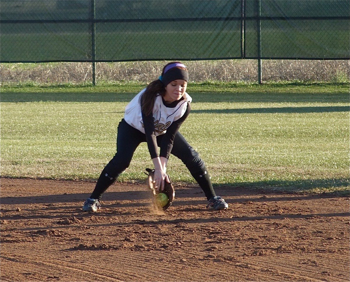 Image: Drew scoops — Senior 1st Baseman Drew Windham scoops in a grounder before the game.