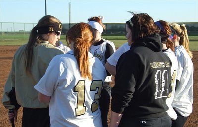 Image: Coach Reeves instructs — Coach Jennifer Reeves lays out the game plan to her infielders.