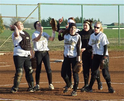 Image: Mound cheer — Infielders meet at the mound to do a cheer.
