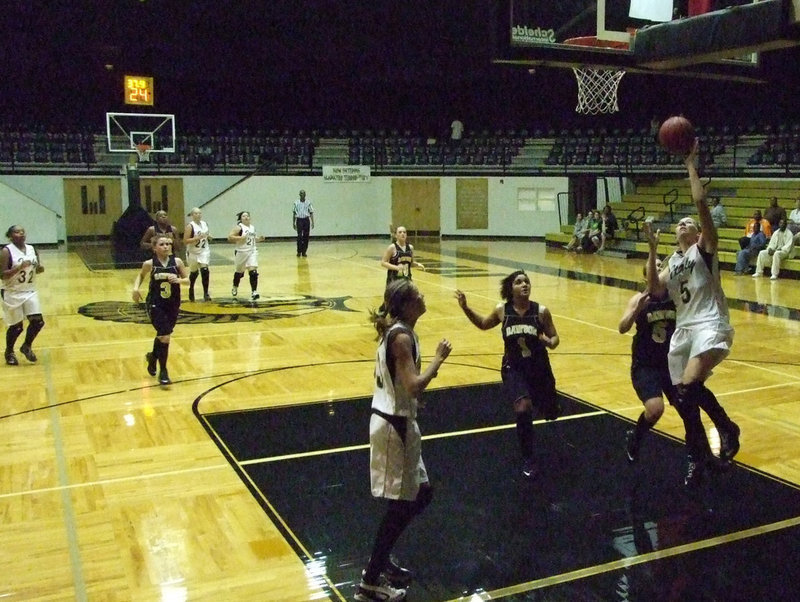 Image: DeMoss Jumps — Becca DeMoss #5 gave 18 points to the Lady Gladiators Tuesday night.