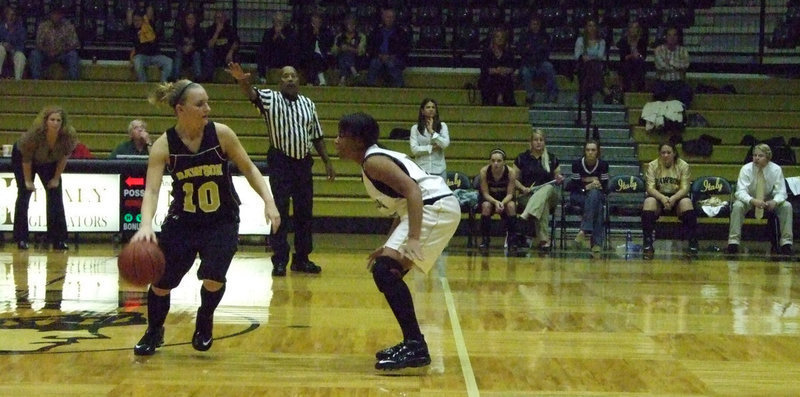 Image: Got Her Guard Up — Birdsong guards #10 Reagan Wardell as she comes in for the score.