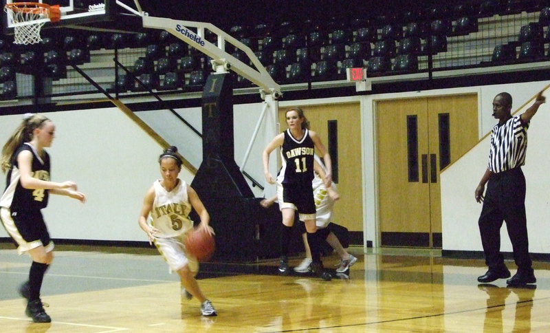 Image: JV Plays Hard — Laura Luna #5 works against the JV Lady Bulldogs from Dawson.