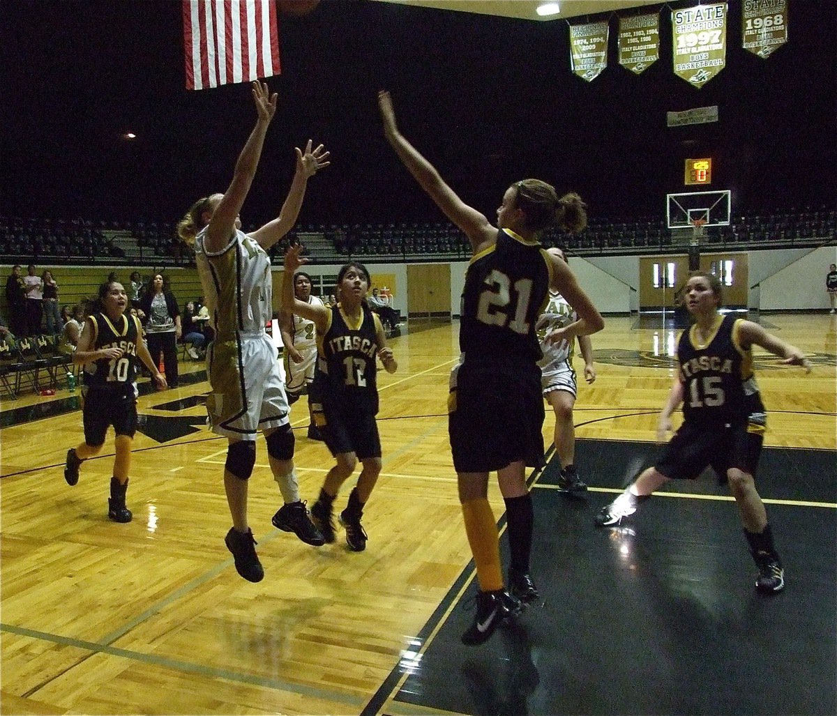 Image: Tate show’s tenacity — Mary Tate shoots and hits a clutch jump shot late in the game.