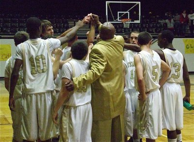 Image: JV Gladiators huddle — Coach Larry Mayberry huddles with his JV Gladiators near the end of the game.