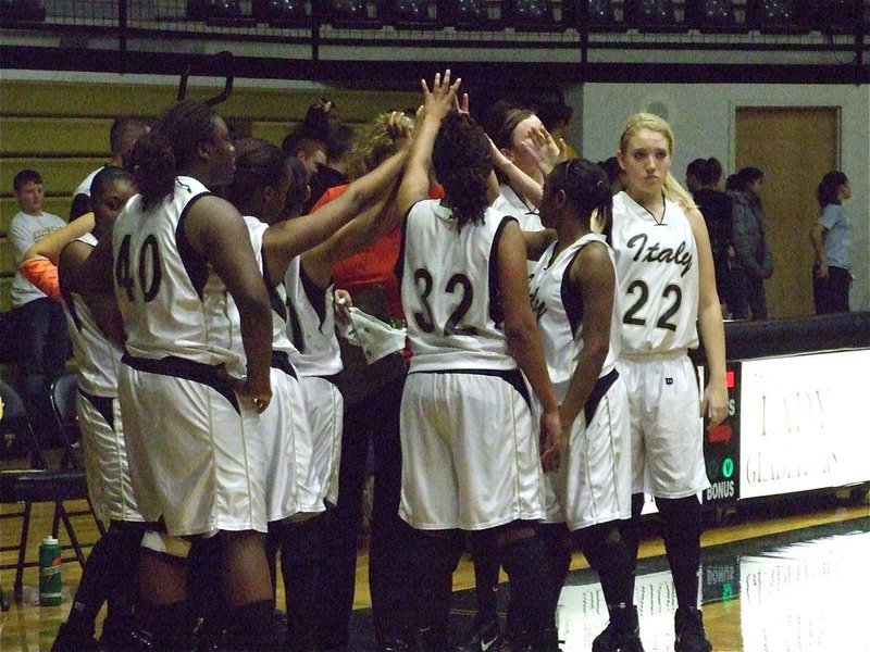 Image: Lady Gladiators huddle — The Lady Gladiators try to find away to tie the game with just seconds remaining.