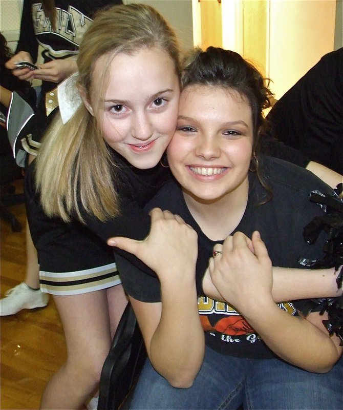 Image: Kelsey and Cori — Kelsey Nelson and Cori Jeffords hug it out during Pack The Dome Night.