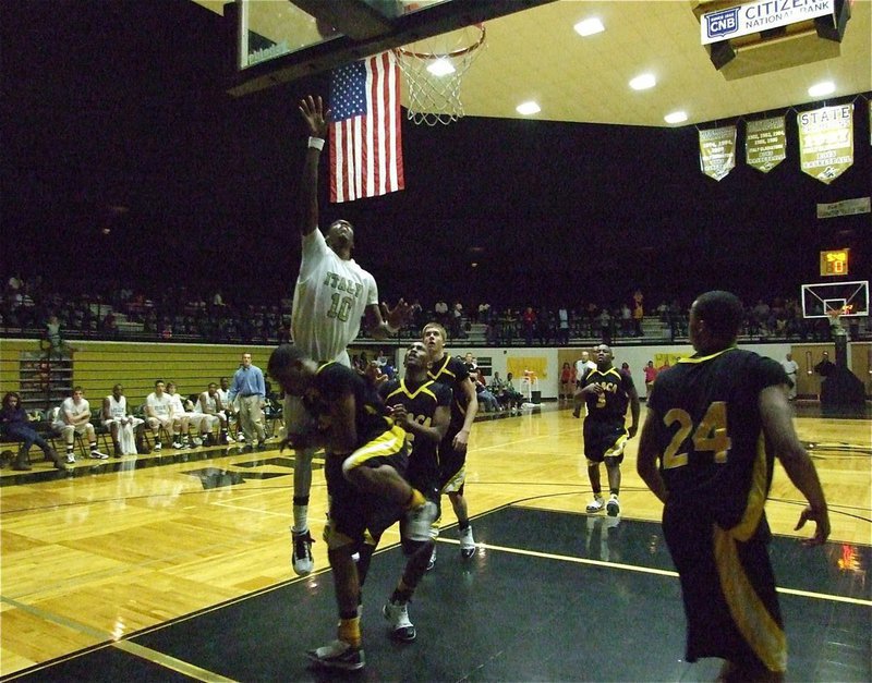 Image: Reaching the stars — Italy’s John Isaac(10) appears to touch the stars as he scores against Itasca helping the Gladiators to a 69-55 win over their rivals.