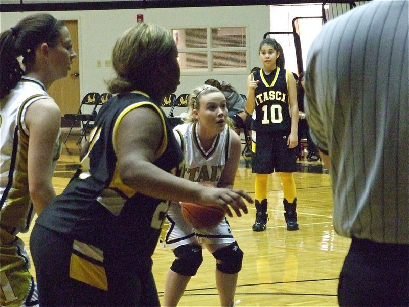 Image: Gilley glares at the goal — Shelbi Gilley(14) prepares to shoot a free throw.