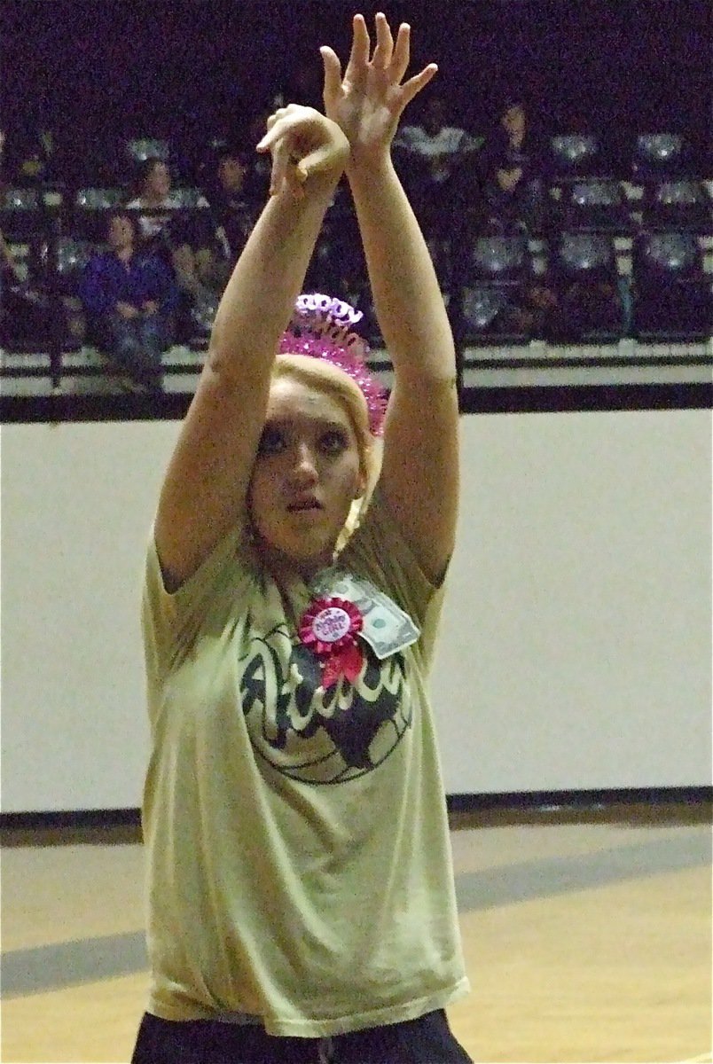 Image: Sweet sixteen — Megan Richards warms up while wearing her Happy Birthday tiara.