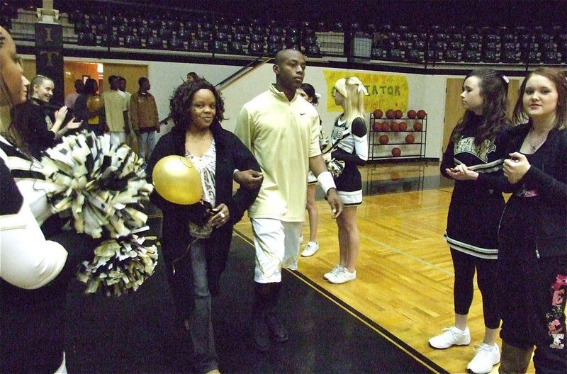 Image: Aren’t moms great! — Senior forward Desmond Anderson escorts his mother, Lajuana Anderson, on “Parent Night.”