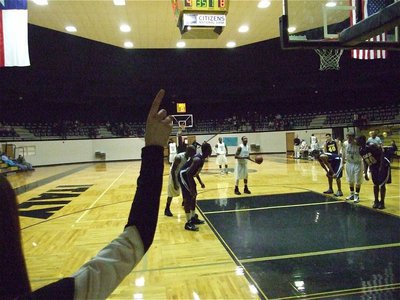 Image: We are #1 — Drew Windham holds up the #1 sign while De’Andre Sephus(20) takes a free shot.