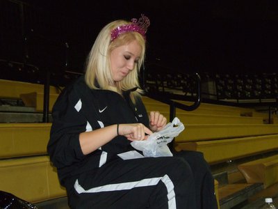 Image: Megan opens her gift — Celebrating her 16th birthday, Lady Gladiator Megan Richards opens her gifts before the game.
