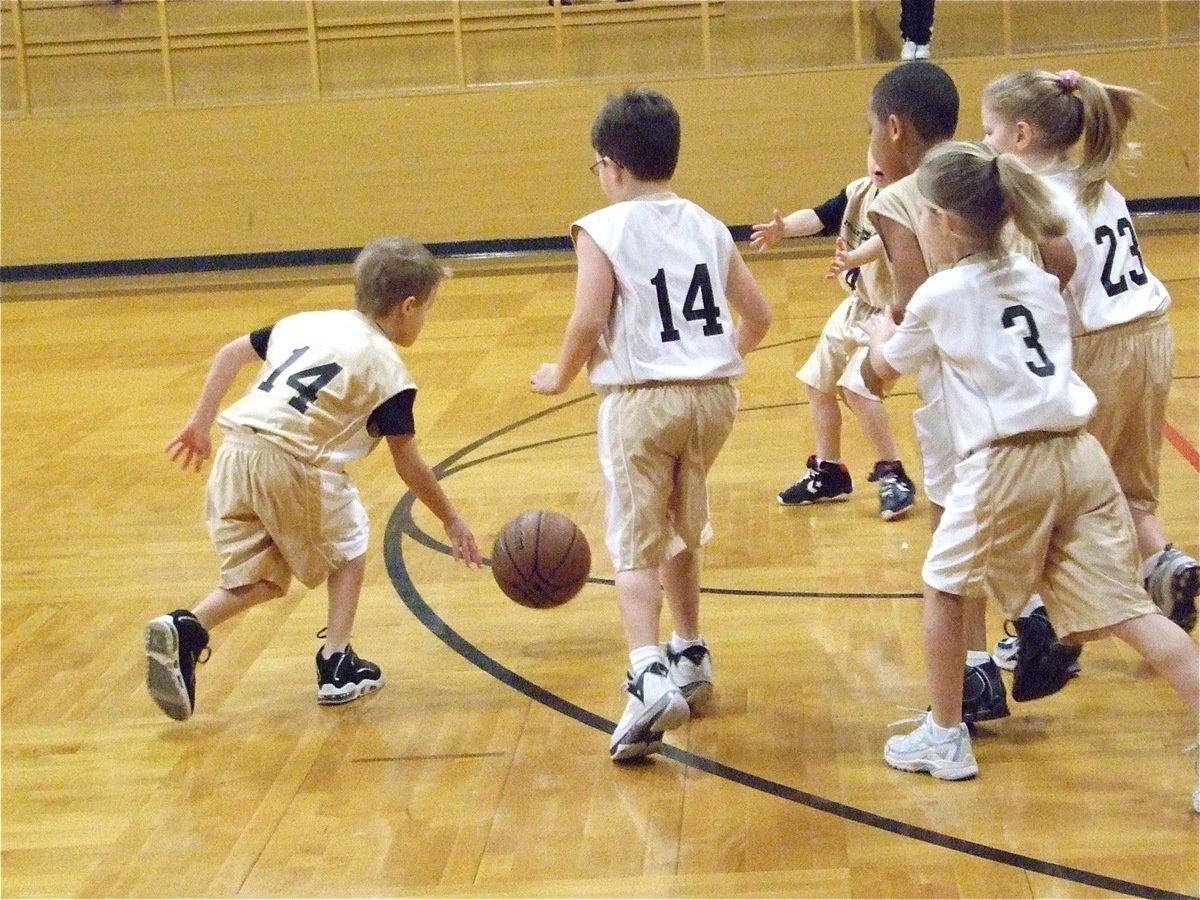 Image: Reese dribbles — Italy 9’s Reese Janek(14) shows some fancy dribbling as heads toward the goal. Italy 10’s Gage Wafer(14), Abby Evans(3) and Sydney Lowenthal(23) try to slow him down.