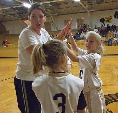 Image: Gimme five, Coach! — Italy 10 consultant, Dustie Jones, gives Courtney Riddle(10) a high five as Abby Evans(3) looks on.