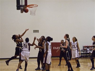 Image: Trying to create — Jaleecia Fleming tries a reverse layup against the Lady Eagles.
