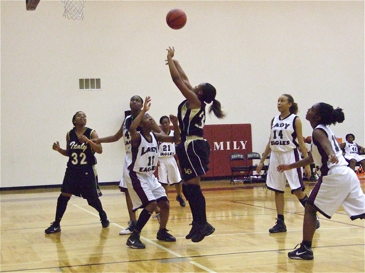 Image: Brianna Burkhalter — Brianna Burkhalter(23) shoots while Jaleecia Fleming(32) prepares to rebound.