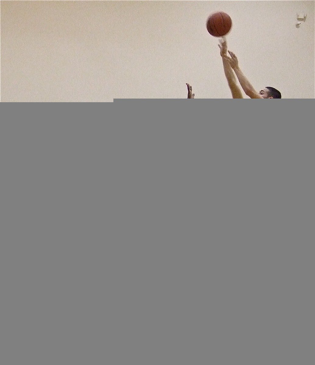 Image: Oscar over the top — Oscar Gonzalez(3) hits a jumper over the Eagles.