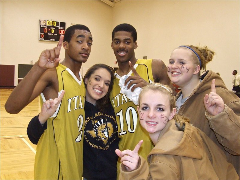 Image: Fan support! — Gladiators Heath Clemons(2) and John Isaac(10) celebrate with their fans Kelli Strickland, Abby Griffith and Julia McDaniel after their big win in Dallas.