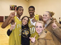 Image: Fan support! — Gladiators Heath Clemons(2) and John Isaac(10) celebrate with their fans Kelli Strickland, Abby Griffith and Julia McDaniel after their big win in Dallas.