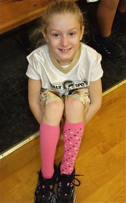 Image: See my socks! — Courtney Riddle(10) shows off her sill socks during the game.