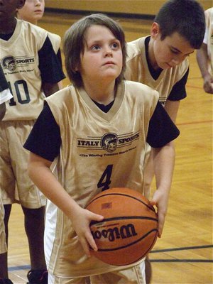 Image: Cason concentrates — Cason Roberts(4) takes his time at the free throw line.