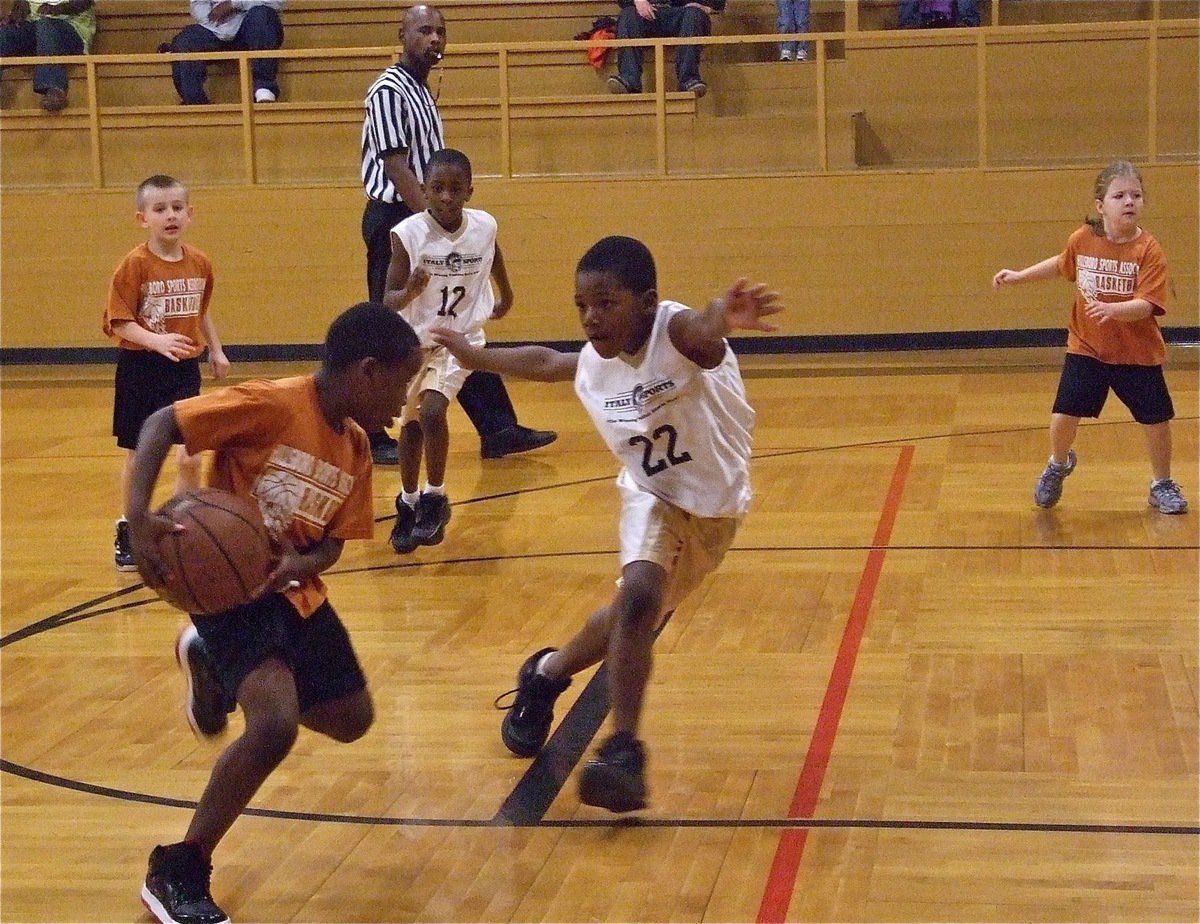 Image: Ricky defends — Defending the paint is Ricky Pendleton(22) as his teammate Jaylon Davis(12) hustles over to assist.