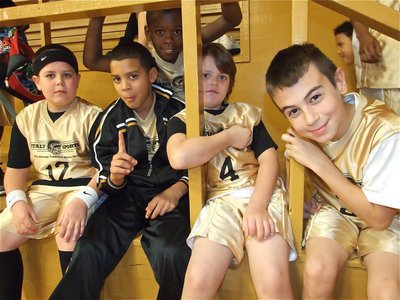 Image: Ready to play — 3rd and 4th grade boys relax before their game.